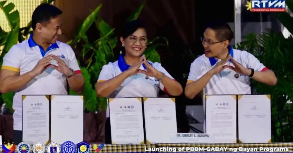 Education Secretary Juan Edgardo Angara, CHED Chairperson Shirley Agrupis, and TESDA Director General Jose Francisco Benitez present the signed joint memorandum circular outlining the guidelines for the Bagong Pilipinas Merit Scholarship Program in Ilocos Norte on Jan. 23, 2026.